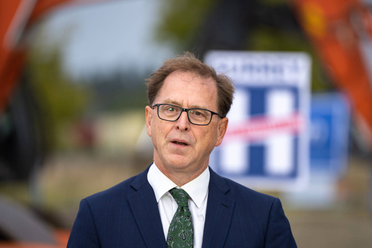 Health Minister Adrian Dix, here seen at an announcement for a new hospital in Surrey B.C. on Tuesday, September 12, 2023, said new six minimum nurse-to-patient ratios will improve quality of care for patients and working environments for nurses. (THE CANADIAN PRESS/Ethan Cairns)