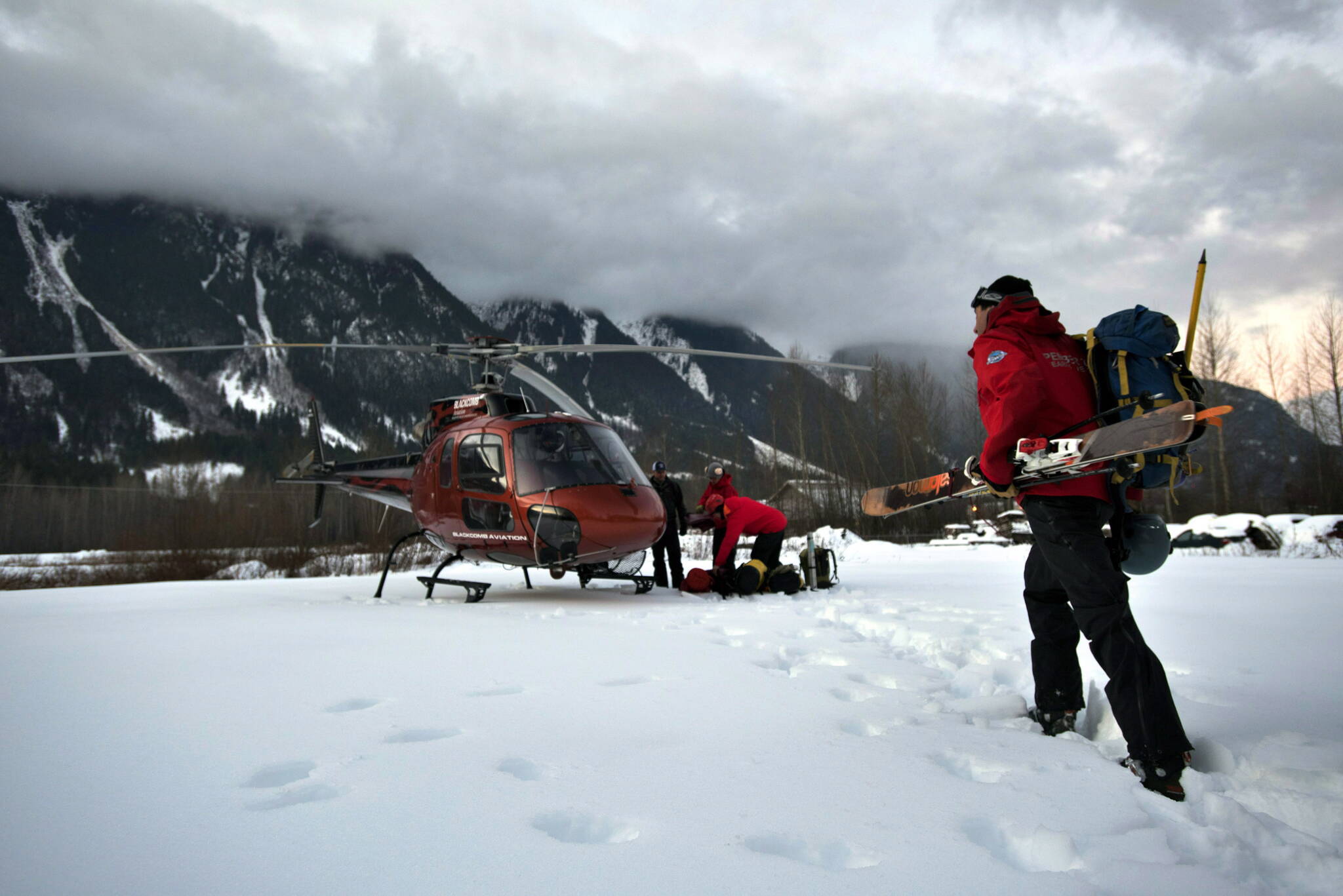 Six skiers have been rescued in two separate operations in the mountains in southwestern British Columbia. Rescue crew members board a helicopter in Pemberton, B.C. in a Monday, Jan.12, 2015 file photo. THE CANADIAN PRESS/Dave Steers