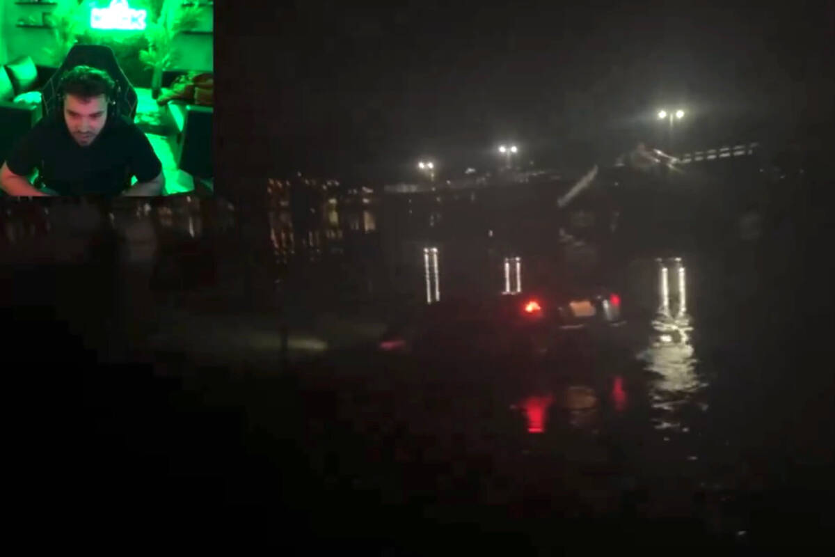 A screenshot from a live-streamed video on Kick shows a B.C. teen driving a car into the Burrard Inlet on Monday night (March 4). (@AdinRossEmpire/X)