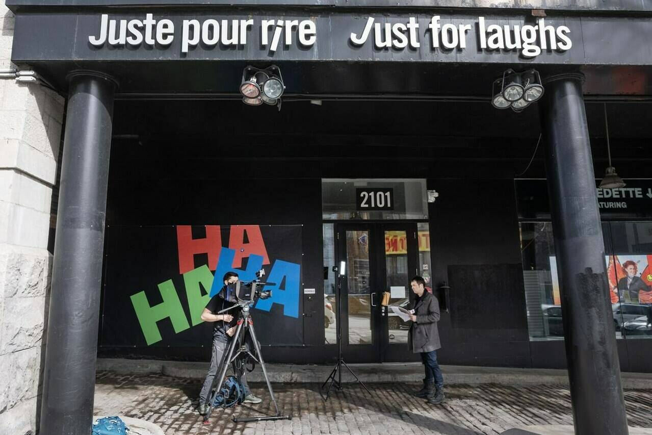 A news crew shoots a report in front of the Just for Laughs theatre Tuesday, March 5, 2024, in Montreal. The company that runs the annual comedy festival has filed for bankruptcy protection. THE CANADIAN PRESS/Ryan Remiorz