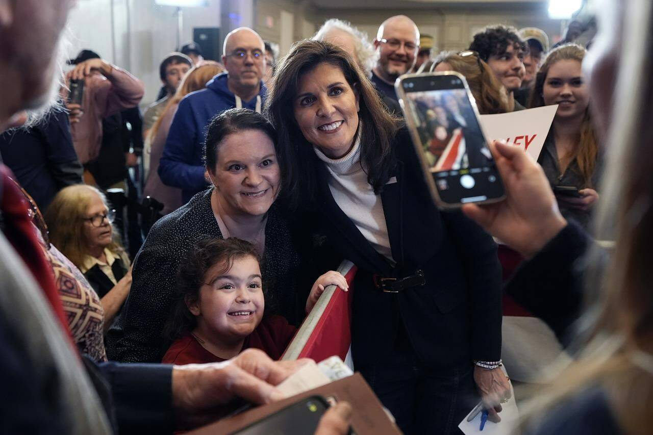 Republican presidential candidate former UN Ambassador Nikki Haley poses for a selfie after speaking at a campaign event in South Burlington, Vermont, Sunday, March 3, 2024. (AP Photo/Michael Dwyer)