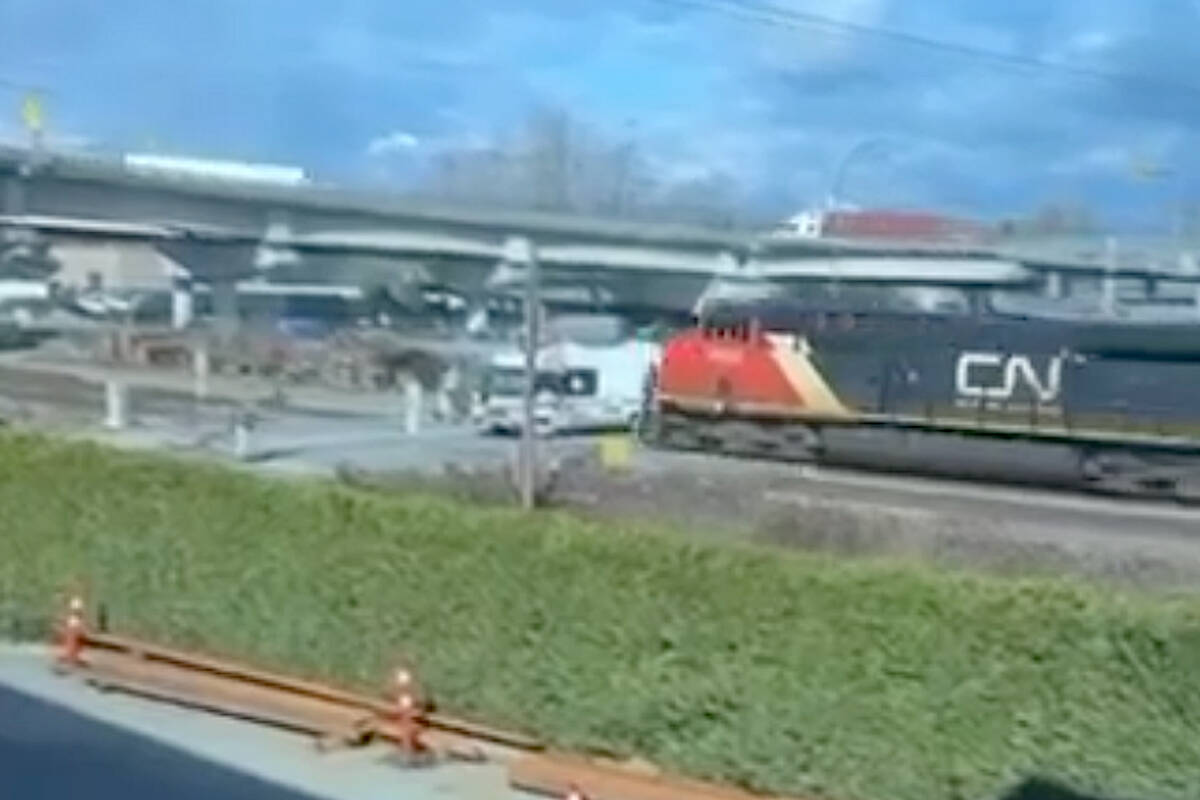A video caught the moment when an RV, stopped on the railway tracks in Langley, was smashed by an oncoming CN Rail train on Tuesday, March 5. No one was injured. (JJ Kennard/Special to Langley Advance Times)