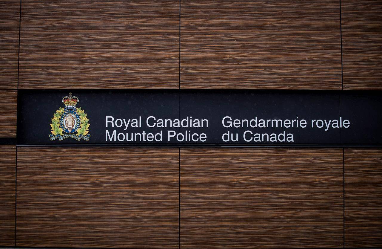 The RCMP logo is seen outside Royal Canadian Mounted Police “E” Division Headquarters, in Surrey, B.C., on Friday April 13, 2018. Two Montreal-area Chinese groups and their director have filed a defamation suit against the RCMP for alleging they hosted clandestine Chinese government “police stations.” THE CANADIAN PRESS/Darryl Dyck