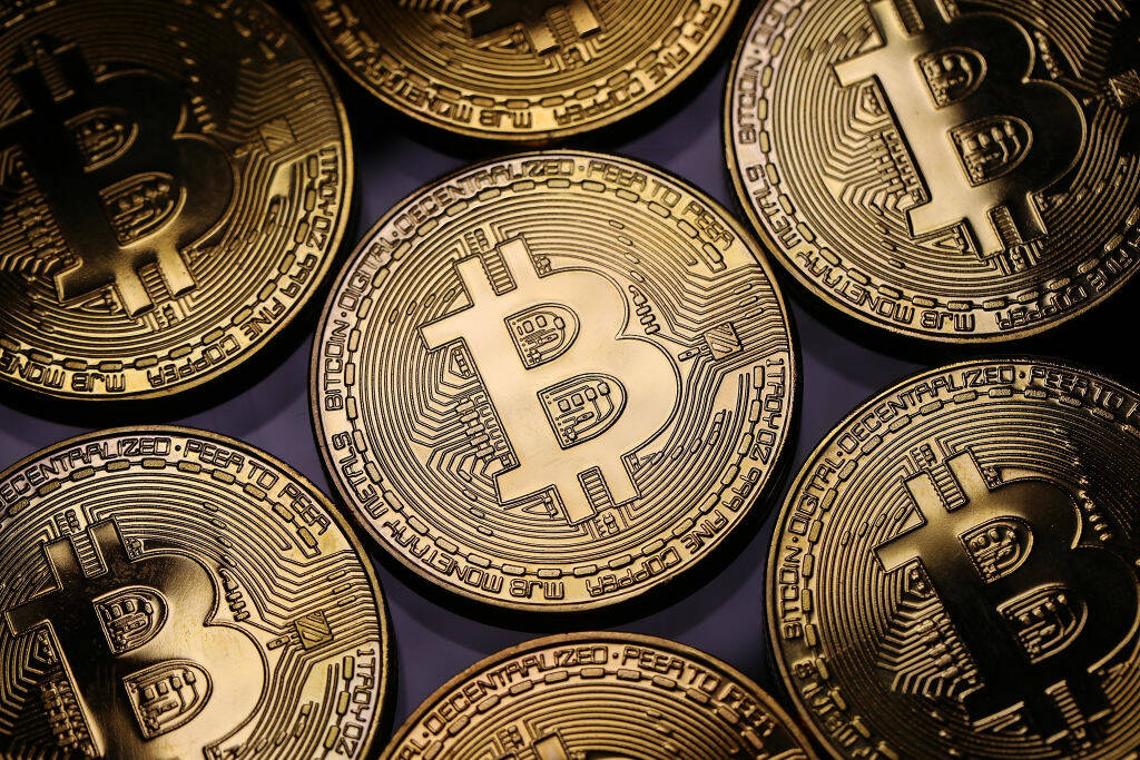 In the first two months of 2024, police in Surrey received 50 reports of cryptocurrency fraud resulting in a loss of $3.2 million. A visual representation of the digital cryptocurrency, Bitcoin on Dec. 07, 2017 in London. (Photo: Dan Kitwood/ Getty Images/TNS/File Photo)