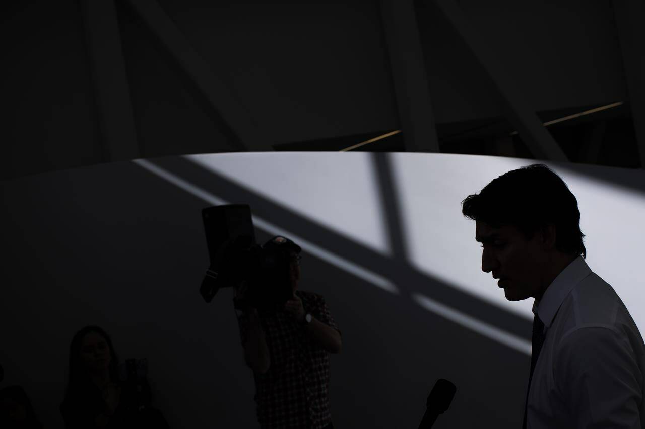 Prime Minister Justin Trudeau is silhouetted as he speaks to the press during an announcement at Women’s College Hospital, in Toronto, Thursday, March 7, 2024. Trudeau says pro-Palestinian protests that include hatred or harassing behavior cross a line. THE CANADIAN PRESS/Cole Burston