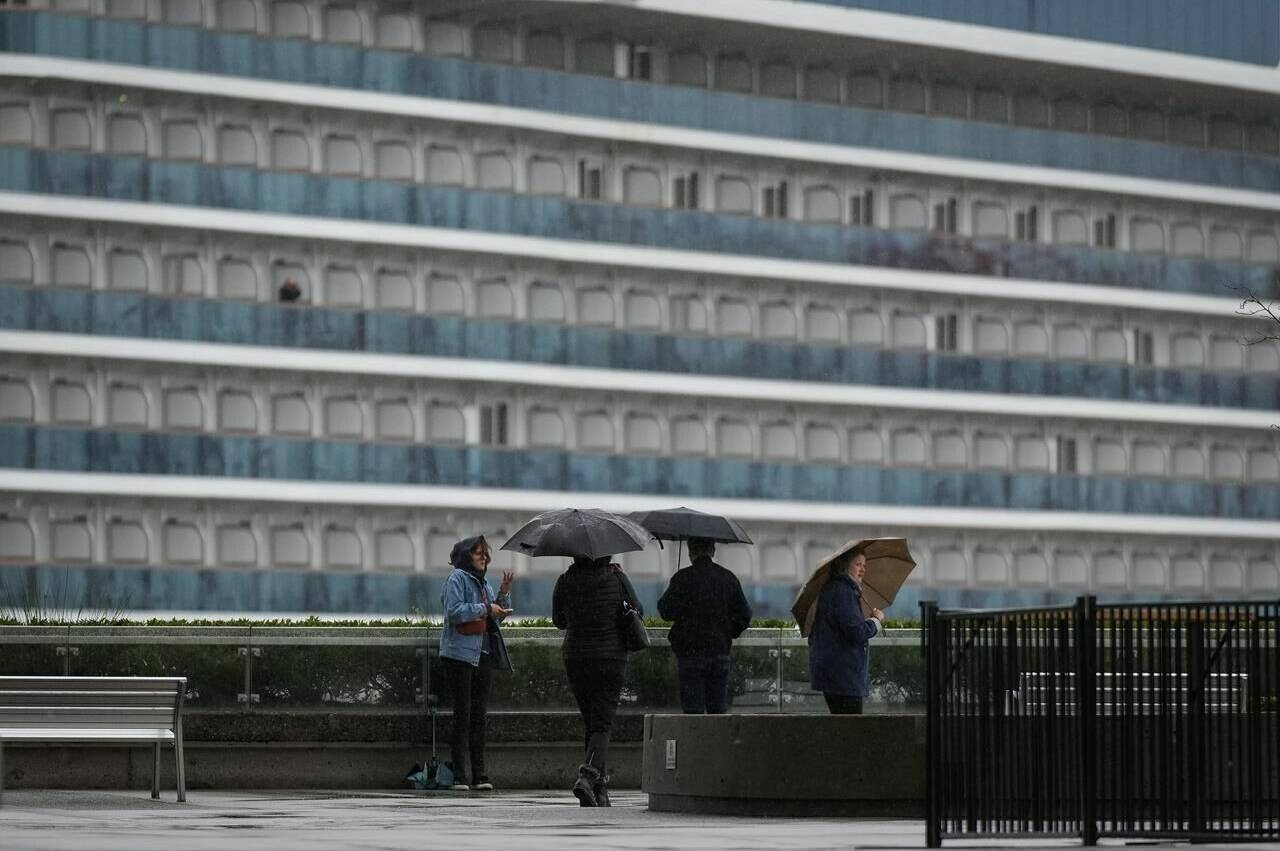 Cruises are surging back to popularity among Canadians this spring break, as more travellers look to try a mode of tourism they may have avoided since the COVID-19 pandemic. People use umbrellas to shield themselves from the rain as the Princess Cruises cruise ship Majestic Princess is seen docked at port, in Vancouver, B.C., Monday, Sept. 25, 2023. THE CANADIAN PRESS/Darryl Dyck