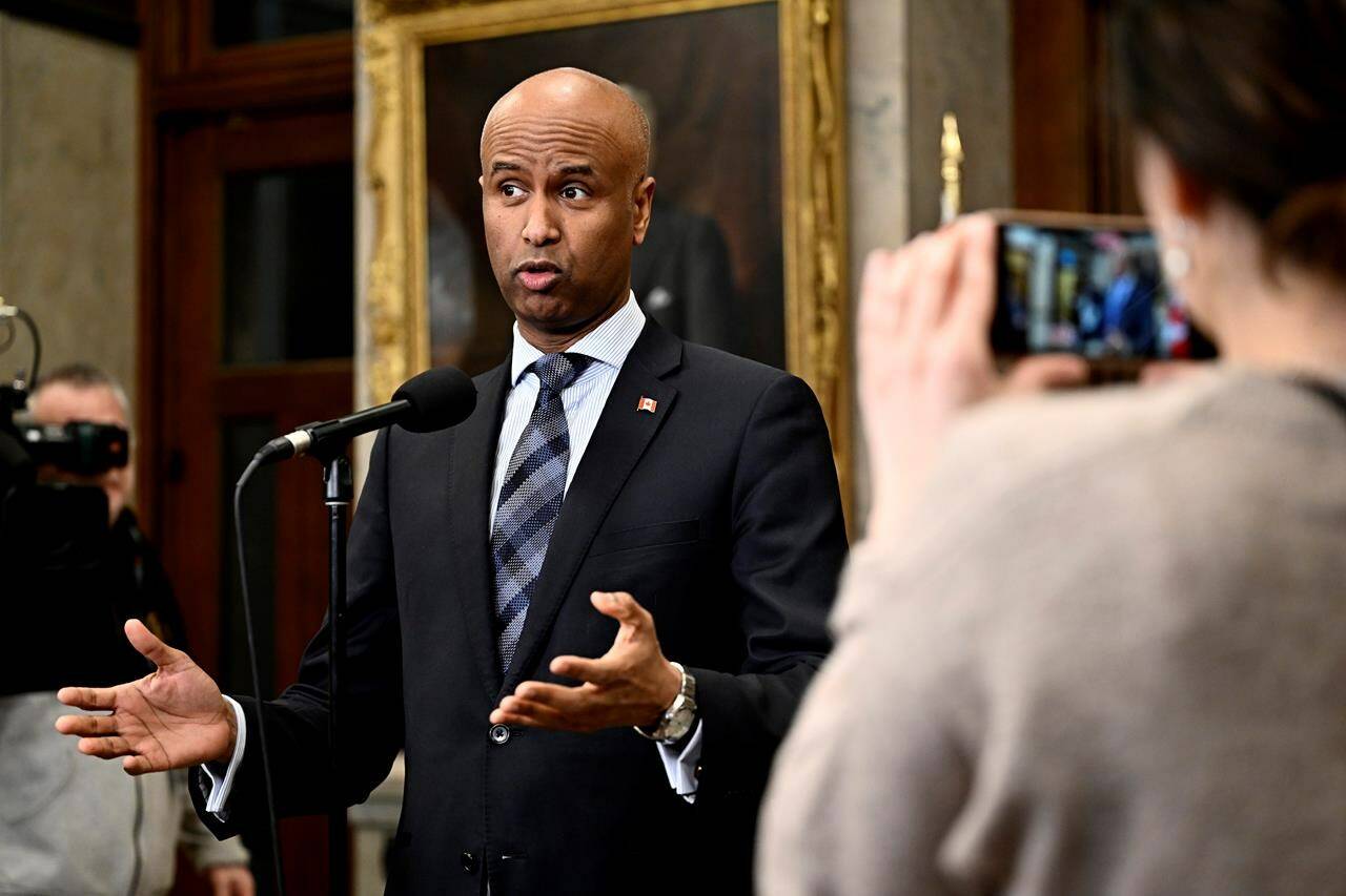 International Development Minister Ahmed Hussen is discussing Canada’s decision on resuming aid to the UN Relief and Works Agency for Palestine Refugees in the Near East today. Hussen speaks in the Foyer of the House of Commons before Question Period on Parliament Hill in Ottawa, Thursday, Feb. 15, 2024. THE CANADIAN PRESS/Justin Tang