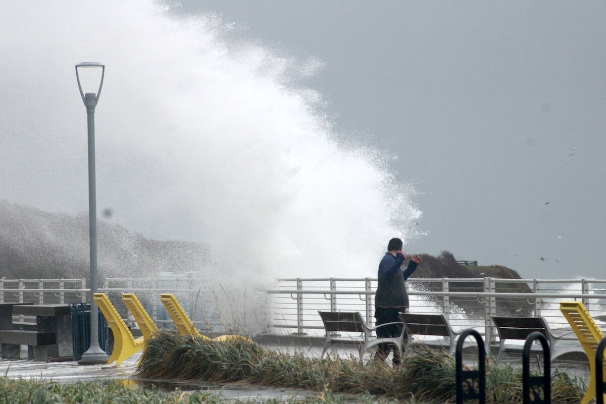 Waves wash over Dallas Road and storm watchers in Victoria on Jan. 9, 2024. Environment Canada issued wind warnings for much of coastal B.C. on March 9. (Jake Romphf/Black Press Media)