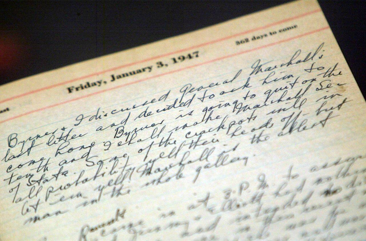 FILE - A portion of a page from a Harry Truman’s 1947 presidential diary is shown at the National Archives in Washington, July 10, 2003. Presidents from George Washington to Joe Biden have kept presidential diaries. In them, they confide in themselves, express raw opinions, trace even the humdrum habits of their day and offer insight-on-the-fly on monumental decisions of their time. It’s where they may also spill secrets they shouldn’t. (AP Photo/Rick Bowmer)