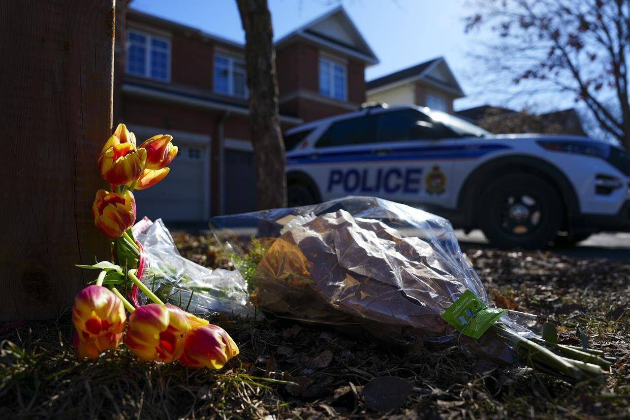 Flowers sit at the scene of a homicide where six people were found dead in the Barrhaven suburb of Ottawa on March 7, 2024. THE CANADIAN PRESS/Sean Kilpatrick