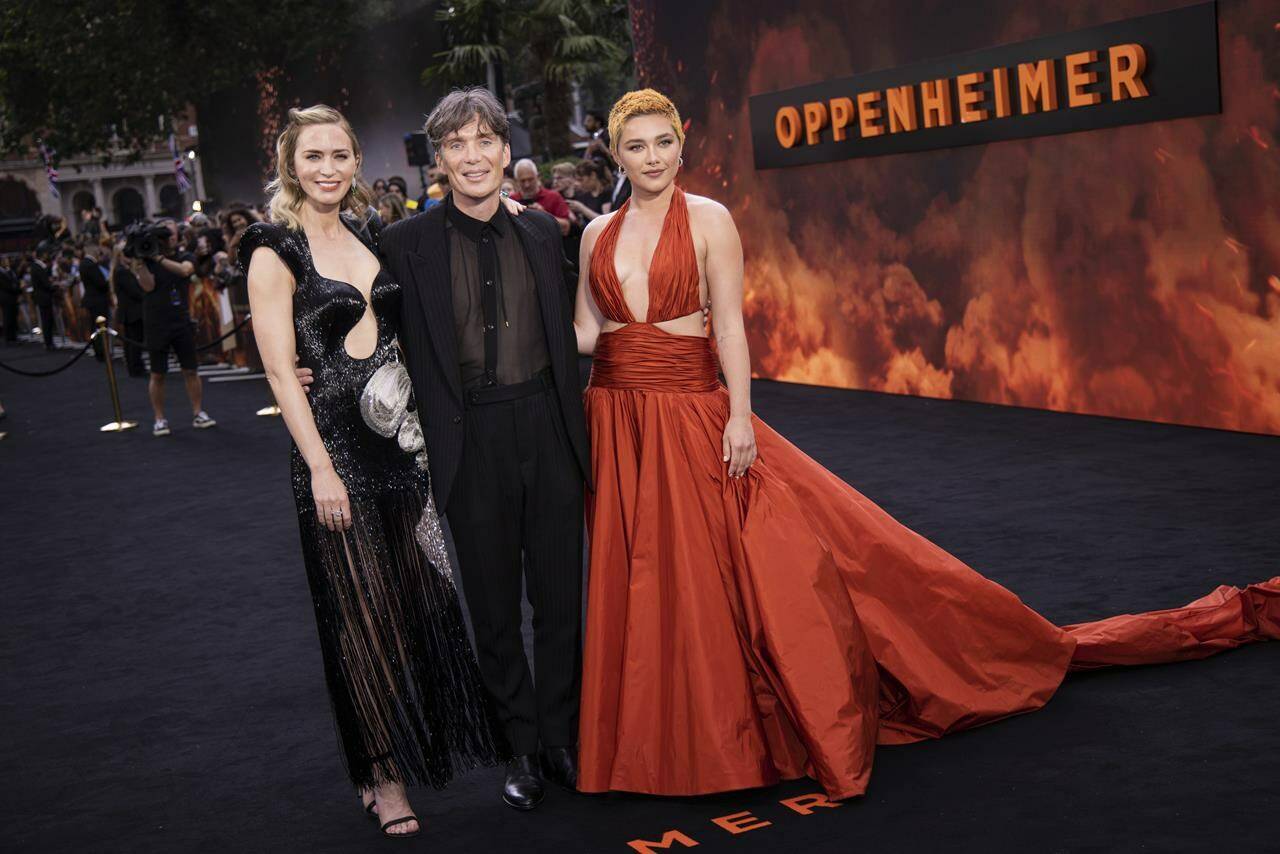 Emily Blunt, from left, Cillian Murphy and Florence Pugh pose for photographers at the premiere for the film “Oppenheimer” on July 13, 2023 in London. (Vianney Le Caer/Invision/AP, File)