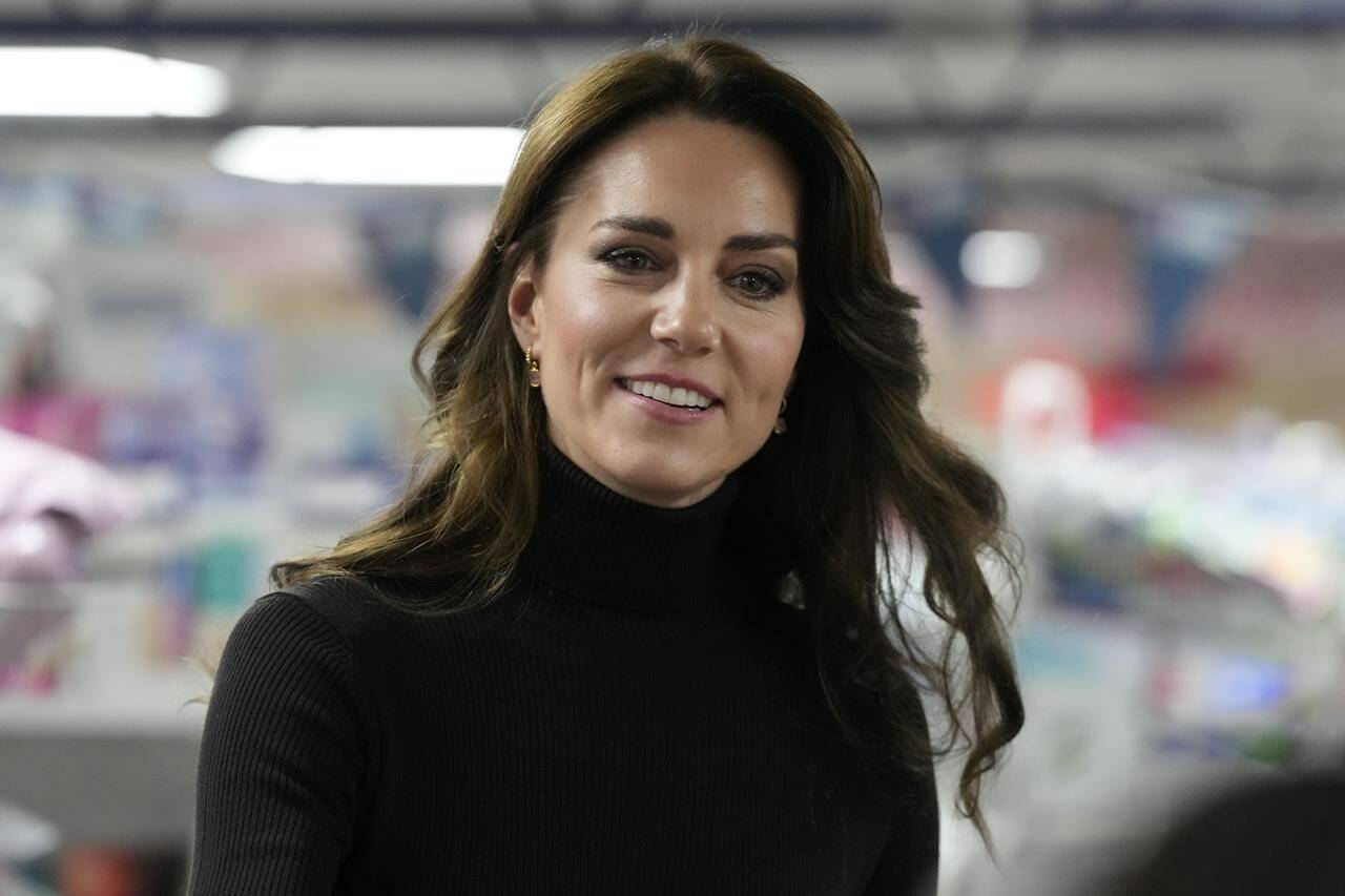 FILE - Britain’s Kate, Princess of Wales smiles during her visit to Sebby’s Corner in north London, Friday, Nov. 24, 2023. Princess Kate apologized Monday, March 11, 2024 for “confusion” caused by her editing of a family photo released by the palace — an image of the British royal and her children that was intended to calm concern and speculation about the princess’s health, but had the opposite effect. (AP Photo/Frank Augstein, Pool, File )