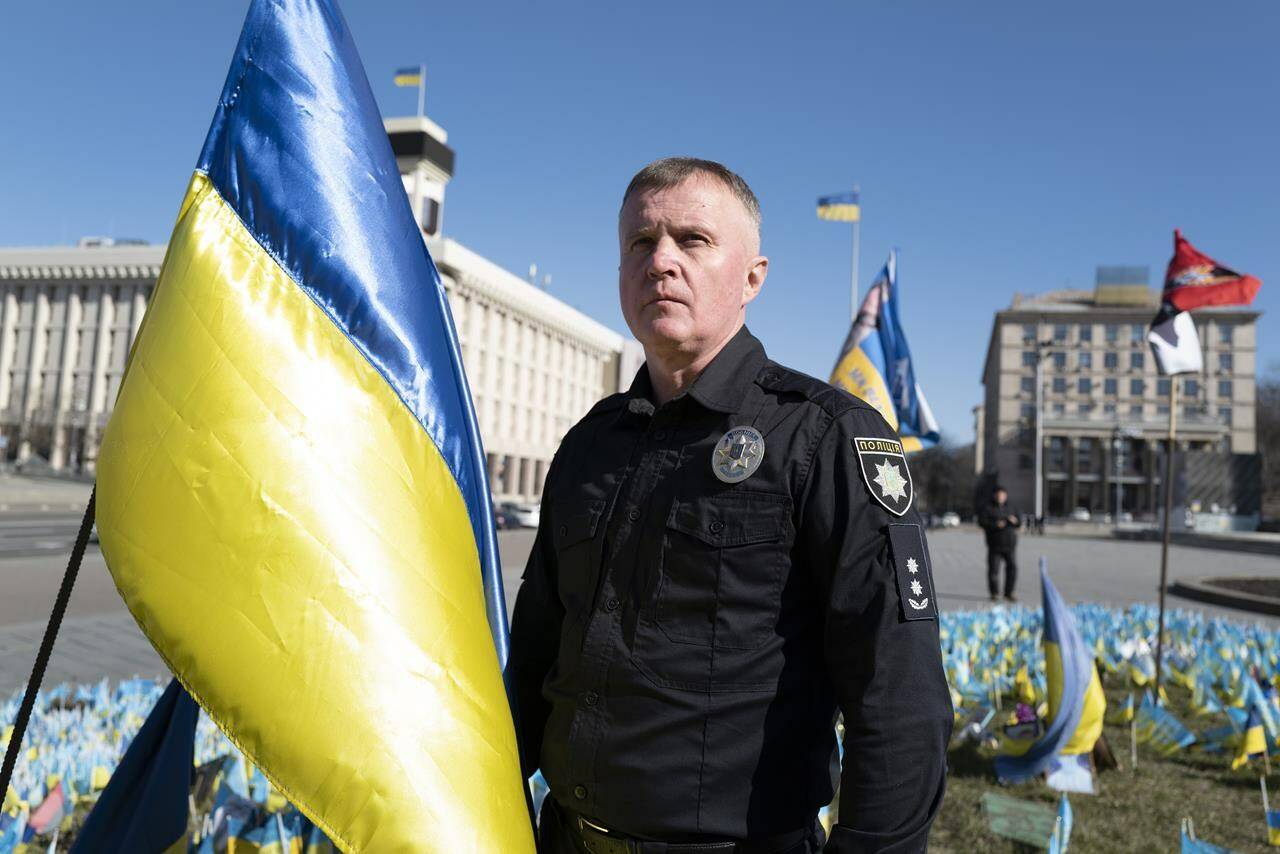 Ukrainian police officer Volodymyr Nikulin poses for a photo in downtown Kyiv, Monday March 11, 2024. Nikulin helped Associated Press journalists during the siege of Mariupol, in the early days of Russia’s invasion of Ukraine in 2022, while filming “20 Days in Mariupol” which won the best documentary Oscar on Sunday night. (AP Photo/Bela Szandelszky)