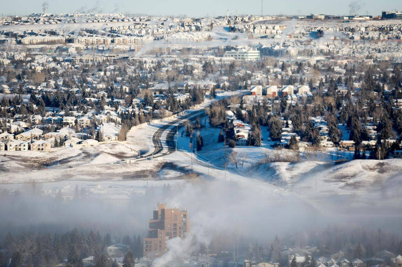 Extreme cold near the start of this year in British Columbia, Alberta and Saskatchewan has led to a damage bill that the Insurance Bureau of Canada says is more than $180 million. An ice fog hangs over neighbourhoods in Calgary on Saturday, Jan. 13, 2024. THE CANADIAN PRESS/Jeff McIntosh