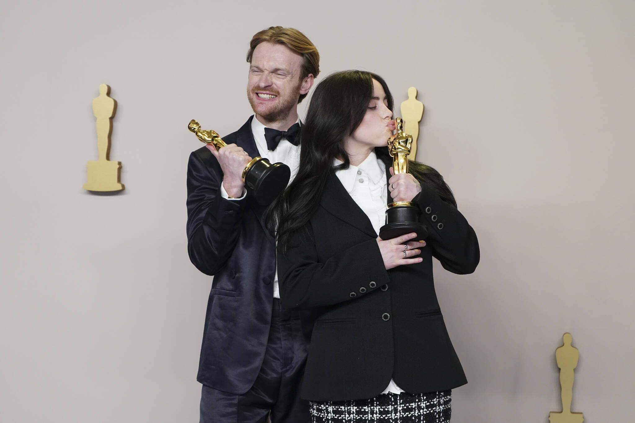 Finneas O’Connell, left, and Billie Eilish pose in the press room with the award for best original song for “What Was I Made For?” from “Barbie” at the Oscars on Sunday, March 10, 2024, at the Dolby Theatre in Los Angeles. (Photo by Jordan Strauss/Invision/AP)