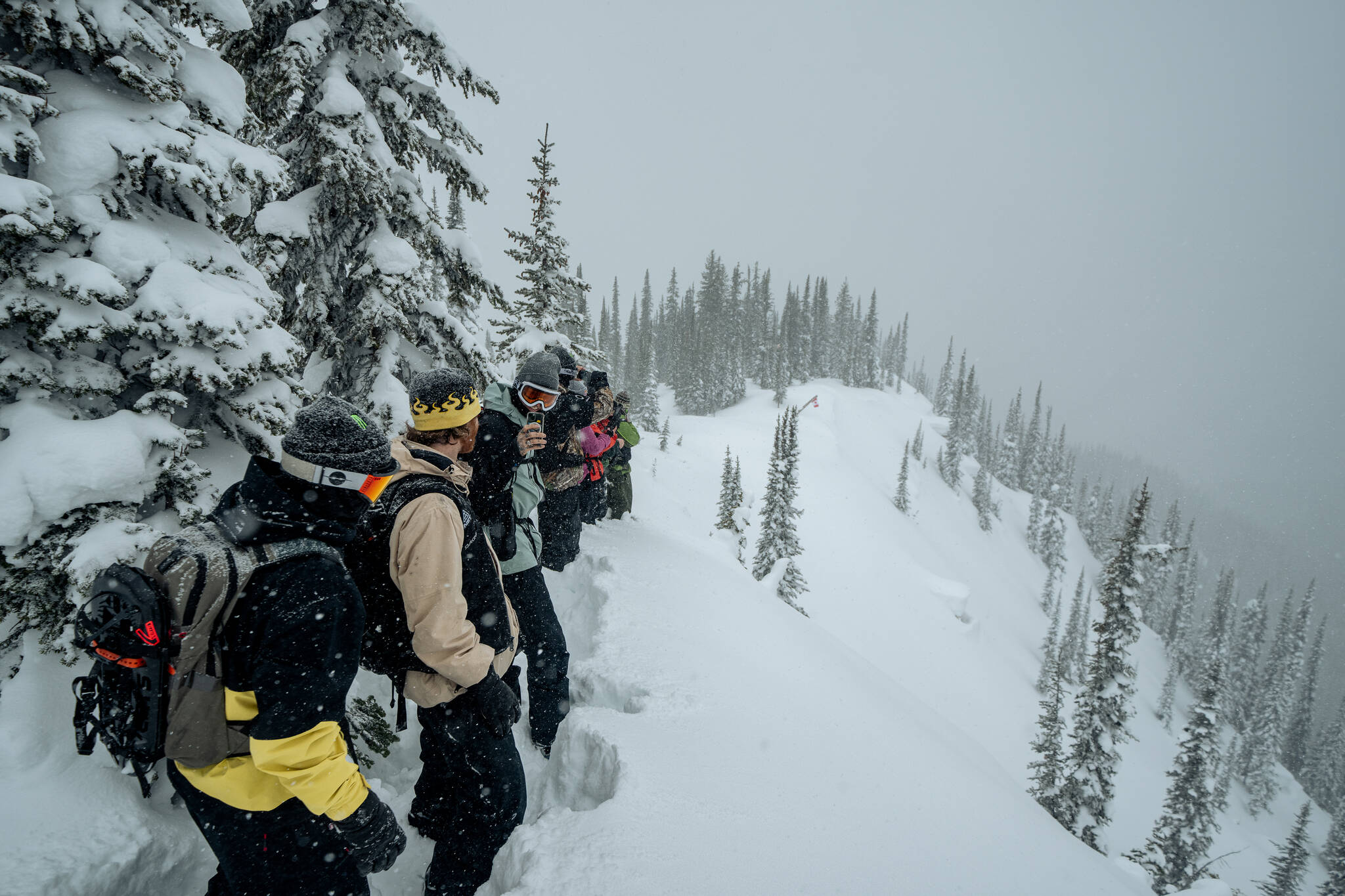 The group of riders eyeing the Revelstoke Mountain Resort venue on Sunday, March 10, during a scouting visit. (Chad Chomlack/Natural Selection Tour)