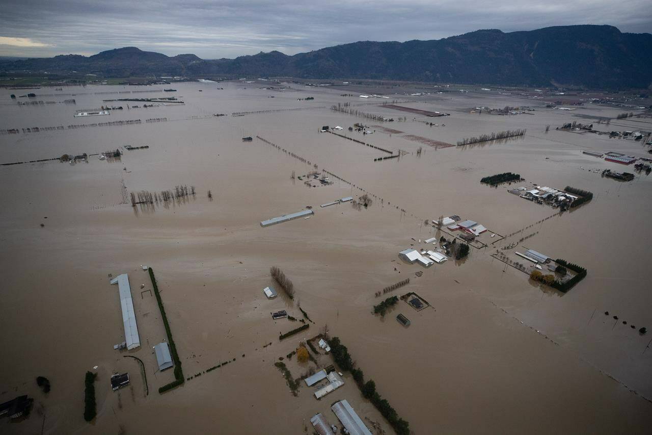 The federal government estimates it will need to pay almost $3.4 billion for its share of the disaster recovery bills for flooding and landslides that devastated British Columbia’s Fraser Valley in November 2021. Flooded farmland is seen in an aerial view from a Canadian Forces reconnaissance flight in Abbotsford, B.C., Monday, Nov. 22, 2021. THE CANADIAN PRESS/Darryl Dyck
