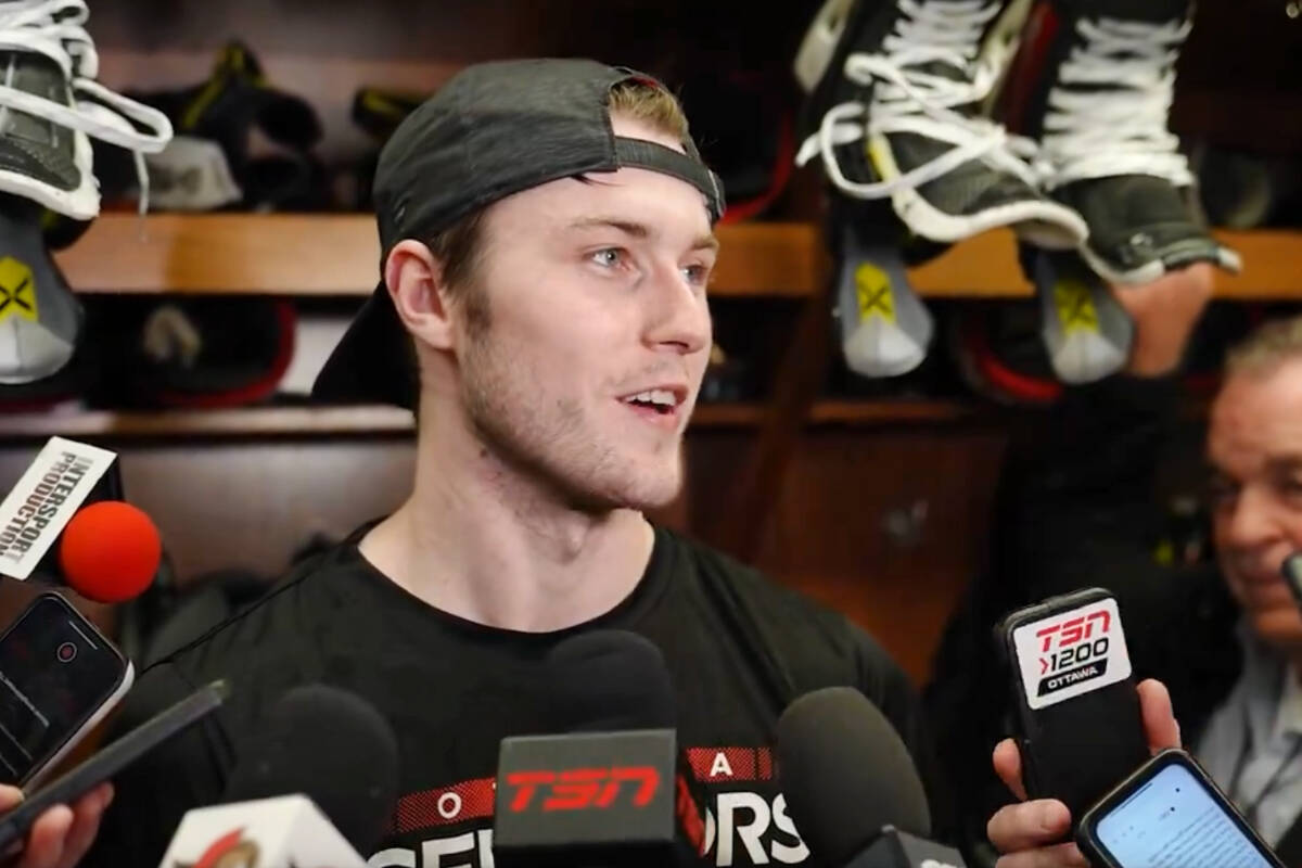 Zack Ostapchuk was surrounded by microphones following the former Vancouver Giants team captain debut with the Ottawa Senators on Tuesday, March 12. (Ottawa Senators)
