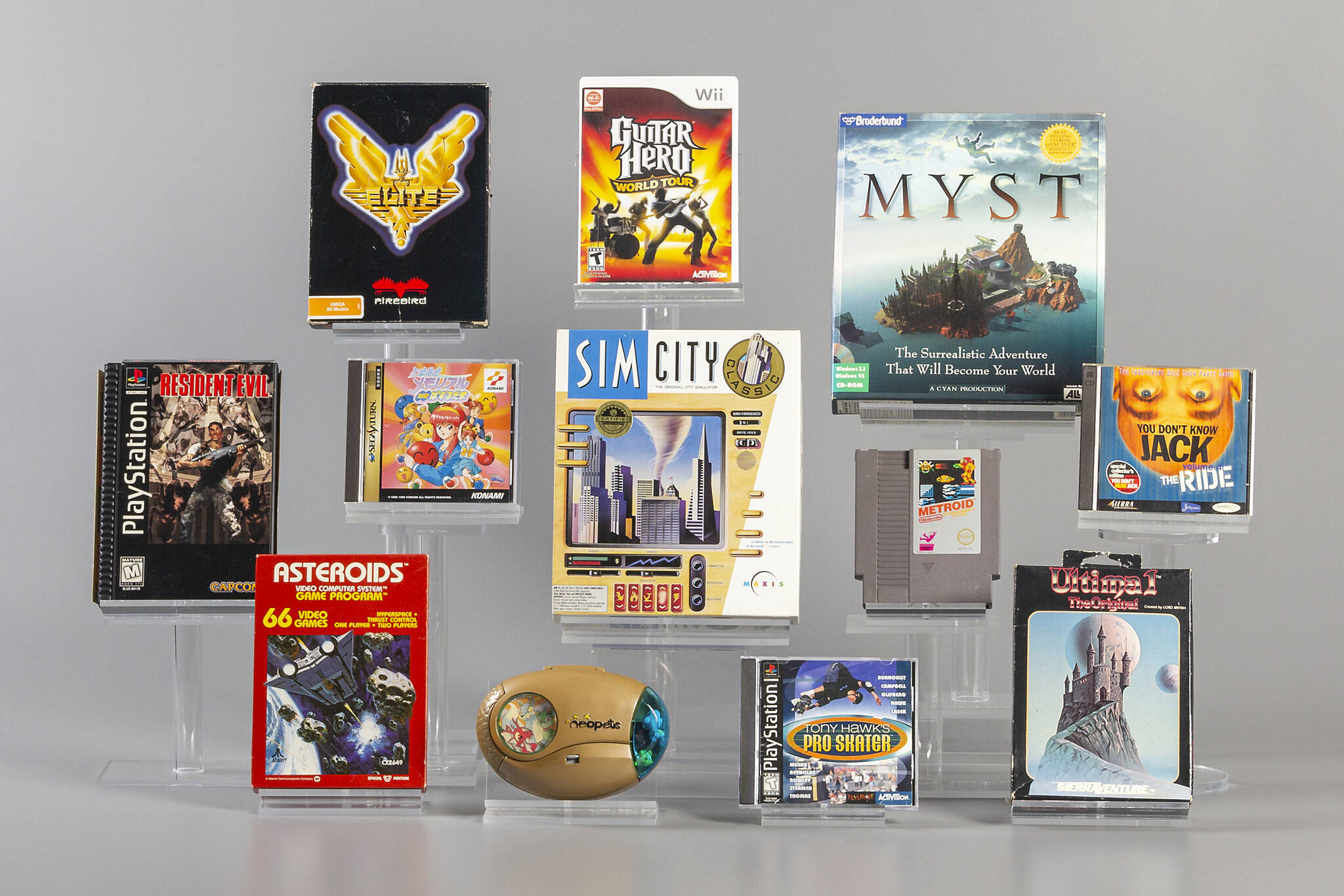 This image provided by The Strong shows 12 finalists being considered for induction into the World Video Game Hall of Fame in Rochester, N.Y. Asteroids, Elite, Guitar Hero, Metroid, Myst, Neopets, Resident Evil, SimCity, Tokimeki Memorial, Tony Hawk’s Pro Skater, Ultima, and You Don’t Know Jack. Three or four of the finalists will be inducted in May following voting by a panel of judges and the public. (Evyn Morgan/The Strong via AP)