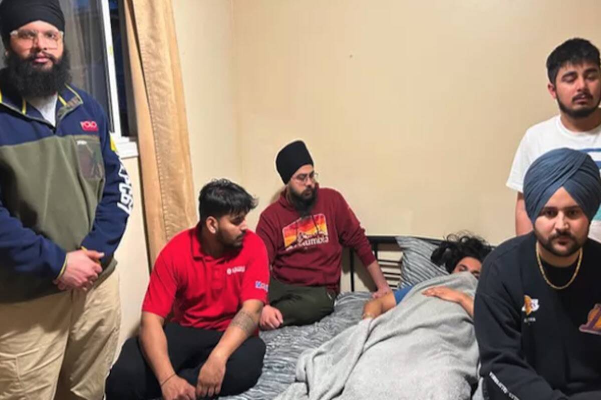 Gagandeep Singh, 21, surrounded by friends after being attacked at a bus stop in Kelowna on March 17,2023. (GoFundMe)