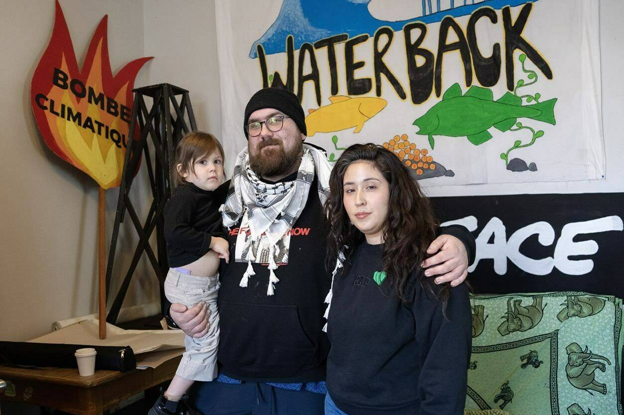 Louis Couillard and Ashley Torres are seen with their daughter, Catalina, at the Greenpeace offices in Montreal, Thursday, March 14, 2024. THE CANADIAN PRESS/Ryan Remiorz