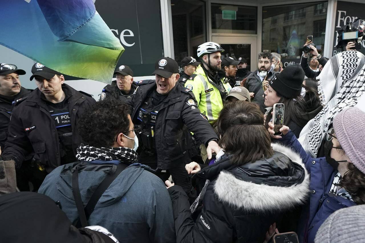 Police clash with protesters outside a fundraising event for Prime Minister Justin Trudeau, in Toronto, Friday, March 15, 2024. Rebel News personality David Menzies was among those charged on Friday as a large gathering of pro-Palestinian protesters rallied outside a downtown Toronto hotel where Trudeau was attending a Liberal party fundraiser.THE CANADIAN PRESS/Arlyn McAdorey