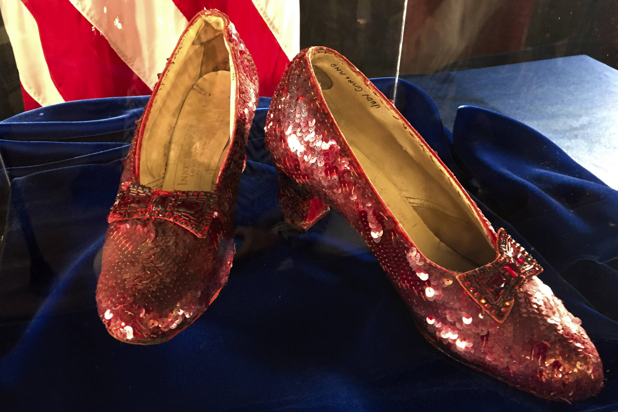 FILE - Ruby slippers once worn by Judy Garland in the “The Wizard of Oz” are displayed at a news conference on Sept. 4, 2018, at the FBI office in Brooklyn Center, Minn. Terry Jon Martin, the aging reformed mobster who has admitted stealing the slippers, gave into the temptation of “one last score” after an old mob associate led him to believe the famous shoes must be adorned with real jewels to justify their $1 million insured value according to a new memo filed ahead of his Monday, Jan. 29, 2024, sentencing in Duluth, Minn. (AP Photo/Jeff Baenen, File)