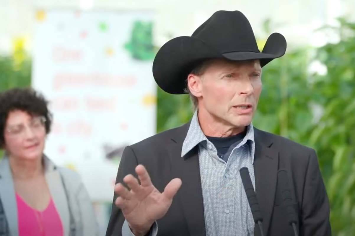 Agriculture Minister Pam Alexis listens as Werner Stump, vice-president of the BC Cattlemen’s Association speaks Monday (March 18) in Delta, where Alexis joined Premier David Eby in announcing $80 million for a program to help ranchers and farmers improve access to water. (Screencap)