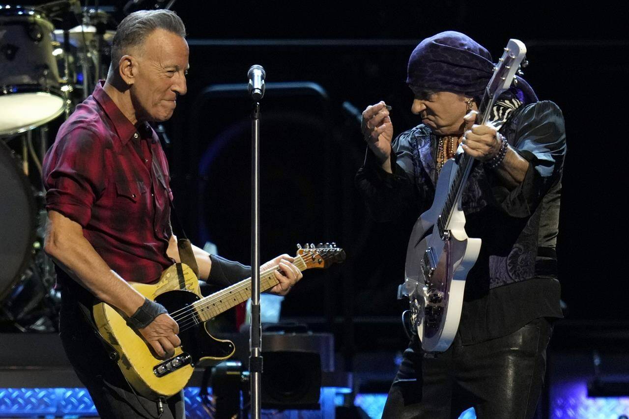 Bruce Springsteen, left, and Stevie Van Zandt, right, play their guitars on stage during his concert of Bruce Springsteen and The E Street Band World Tour 2024 performance Tuesday, March 19, 2024, in Phoenix. (AP Photo/Ross D. Franklin)