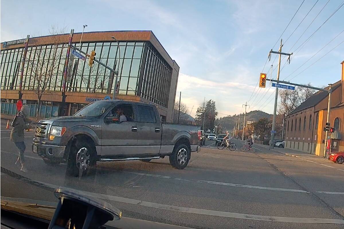 Screenshot from a video shared to Reddit of a pedestrian being struck at Richter St and Bernard Ave in Kelowna. (Reddit)