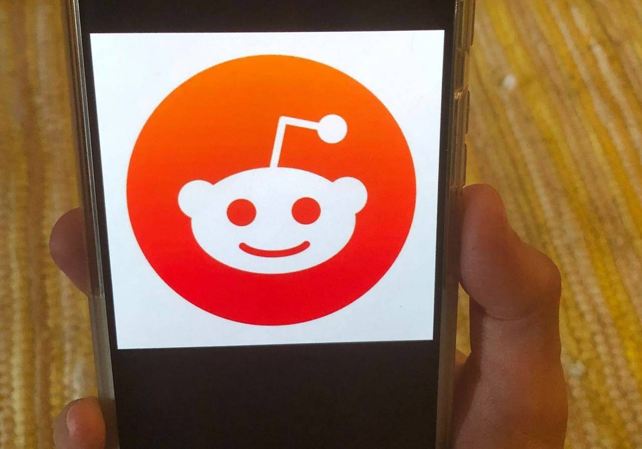 The Reddit logo is displayed on a mobile device in New York, June 29, 2020. Reddit, that vast, lively and sometimes borderline shambolic repository of internet discussion, said Monday, March 11, 2024, that its pending initial public offering may be worth almost three quarters of a billion dollars. (AP Photo/Tali Arbel, File)