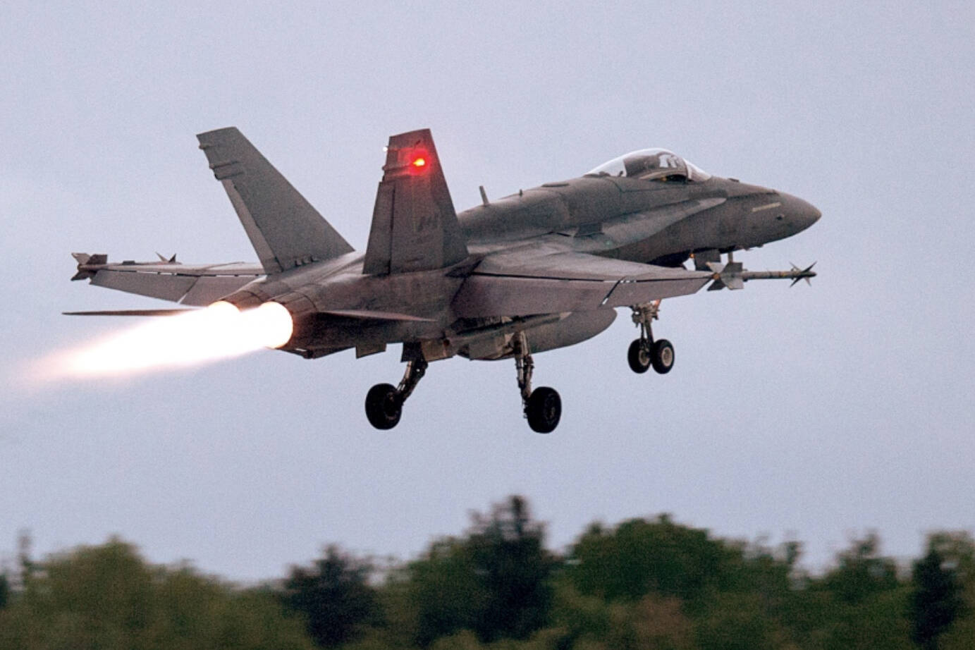 An RCAF CF-18 takes off from CFB Bagotville, Que. on Thursday, June 7, 2018. (THE CANADIAN PRESS/Andrew Vaughan)