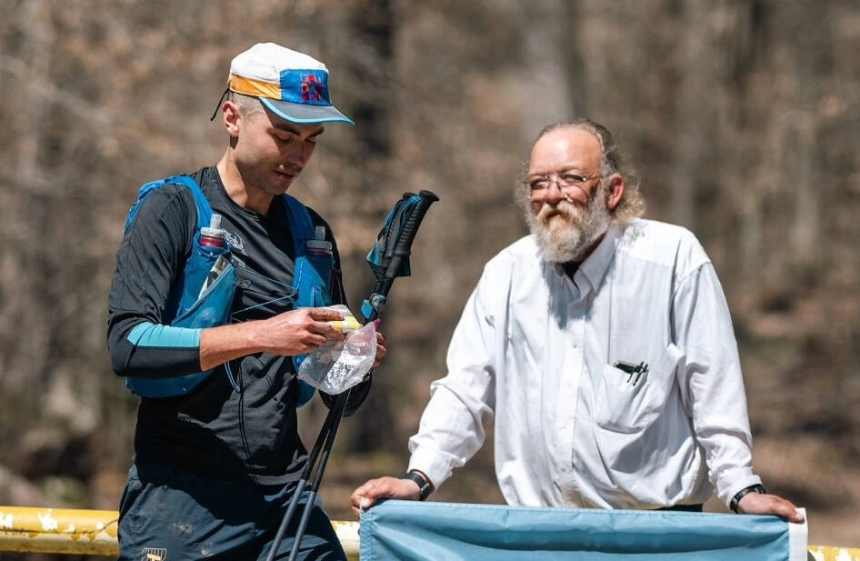 Chilliwack ultra runner Ihor Verys begins the fourth lap of the infamously difficult Barkley Marathon in Tennessee, on March 21, 2024. Race creator Lazarus Lake holds a Ukrainian flag to show his support for the Ukrainian-born runner. (Photo by @howiesternphoto)