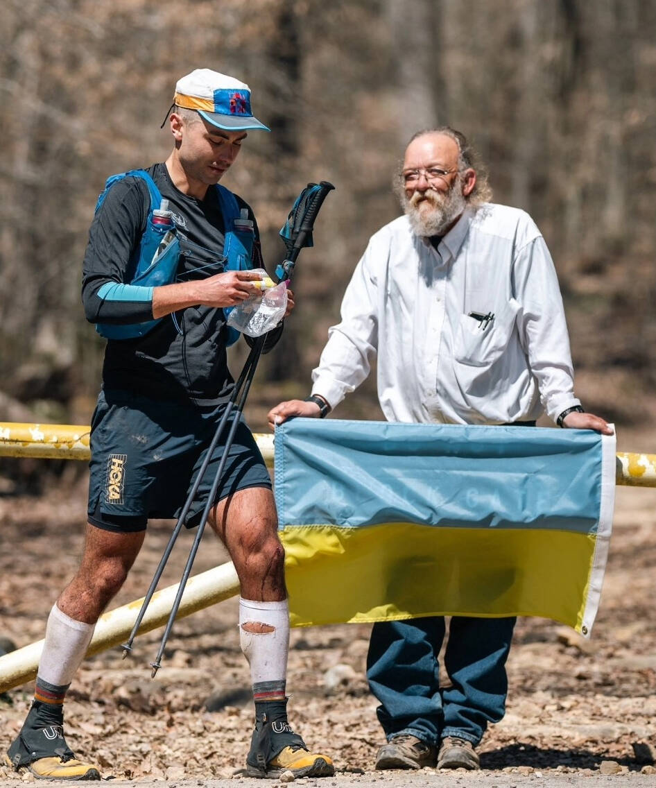 Chilliwack ultra runner Ihor Verys begins the fourth lap of the infamously difficult Barkley Marathon in Tennessee, on March 21, 2024. Race creator Lazarus Lake holds a Ukrainian flag to show his support for the Ukrainian-born runner. (Photo by @howiesternphoto)