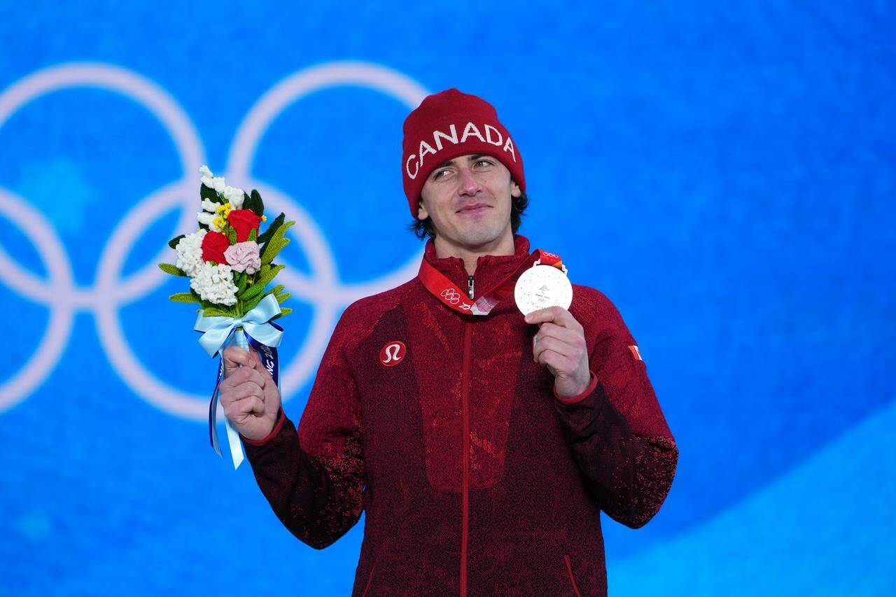 Canada’s Mark McMorris celebrates with his bronze medal during the medal ceremony for men’s snowboard slopestyle at the Beijing Winter Olympics in Zhangjiakou, China, on Monday, Feb. 7, 2022. Canadian snowboarder Mark McMorris is sporting a look these days courtesy of his knee to his face. THE CANADIAN PRESS/Sean Kilpatrick