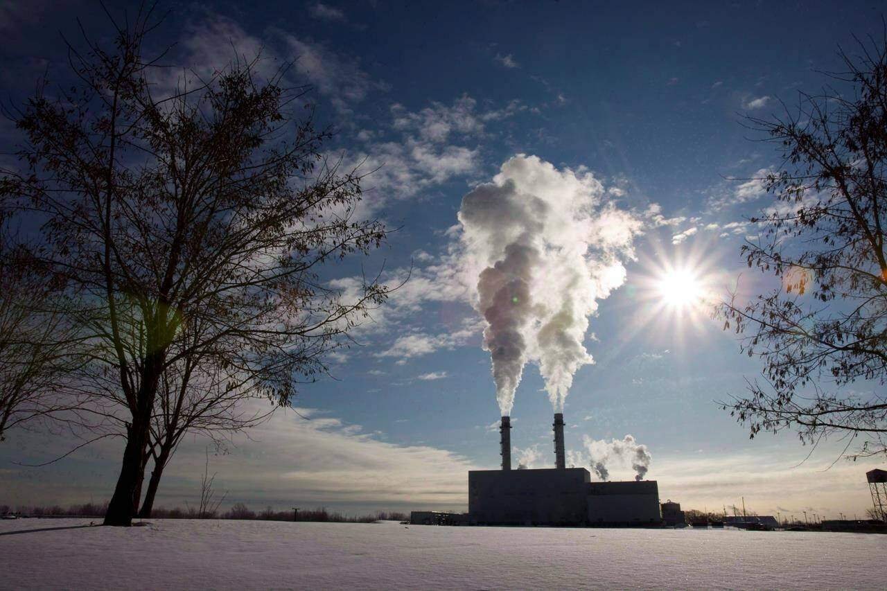 Canada’s carbon price could slash greenhouse gas emissions by more than 100 million tonnes a year by 2030 but only about one-fifth of that will come from the consumer carbon price at the centre of Conservative attacks. Smoke rises from the stacks at an energy facility in Toronto on Thursday January 15, 2009. THE CANADIAN PRESS/Frank Gunn