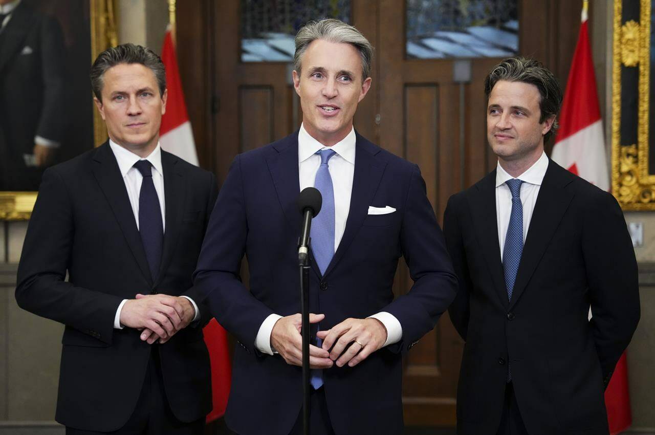 Brian Mulroney’s three sons say there’s no doubt their father would have been thrilled by this week’s public tributes to honour his life. Mark, Ben, and Nicolas Mulroney, left to right, talk to media in the foyer following tributes to their father and late prime minister Brian Mulroney in the House of Commons on Parliament Hill in Ottawa on Monday, March 18, 2024. THE CANADIAN PRESS/Sean Kilpatrick