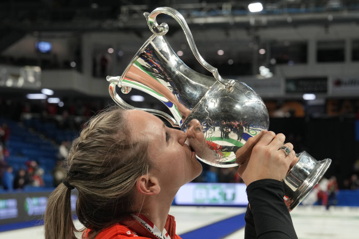 Canada skip Rachel Homan kisses the trophy after defeating Switzerland’s Silvana Tirinzoni rink at the World Women’s Curling Championship gold medal game in Sydney, N.S. on Sunday, March 24, 2024. THE CANADIAN PRESS/Frank Gunn