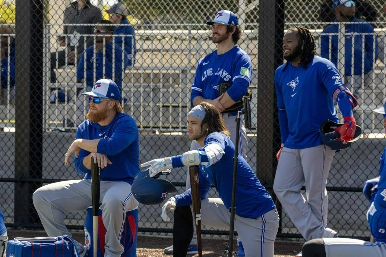 Toronto Blue Jays players (left to right) Justin Turner, Bo Bichette, Jordan Romano and Vladimir Guerrero Jr. watch batting practice in Dunedin, Fla. on Thursday, Feb. 22, 2024. There was no roster makeover, blockbuster trade or eye-popping free-agent signing for the Blue Jays this past off-season. The club is essentially running it back with virtually the same core as last year and hoping the bats return to form. THE CANADIAN PRESS/Frank Gunn