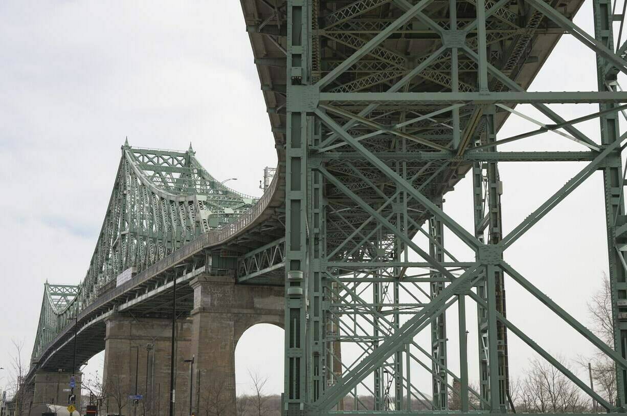 The Jacques Cartier Bridge is seen in Montreal on Tuesday, March 26, 2024. The St. Lawrence Seaway Management Corporation, which runs the shipping route connecting Montreal with Lake Erie, says it monitors traffic along the route 24 hours a day and that steps have been taken to ensure physical infrastructure is secure. THE CANADIAN PRESS/Christinne Muschi