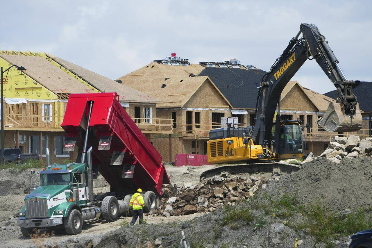 The Canada Mortgage and Housing Corp. says construction of new homes in Canada’s six largest cities remained stable at near all-time high levels last year, driven by a surge of new apartment starts despite demand still outpacing supply for rental housing. New homes are built in Ottawa on Monday, Aug. 14, 2023. THE CANADIAN PRESS/Sean Kilpatrick