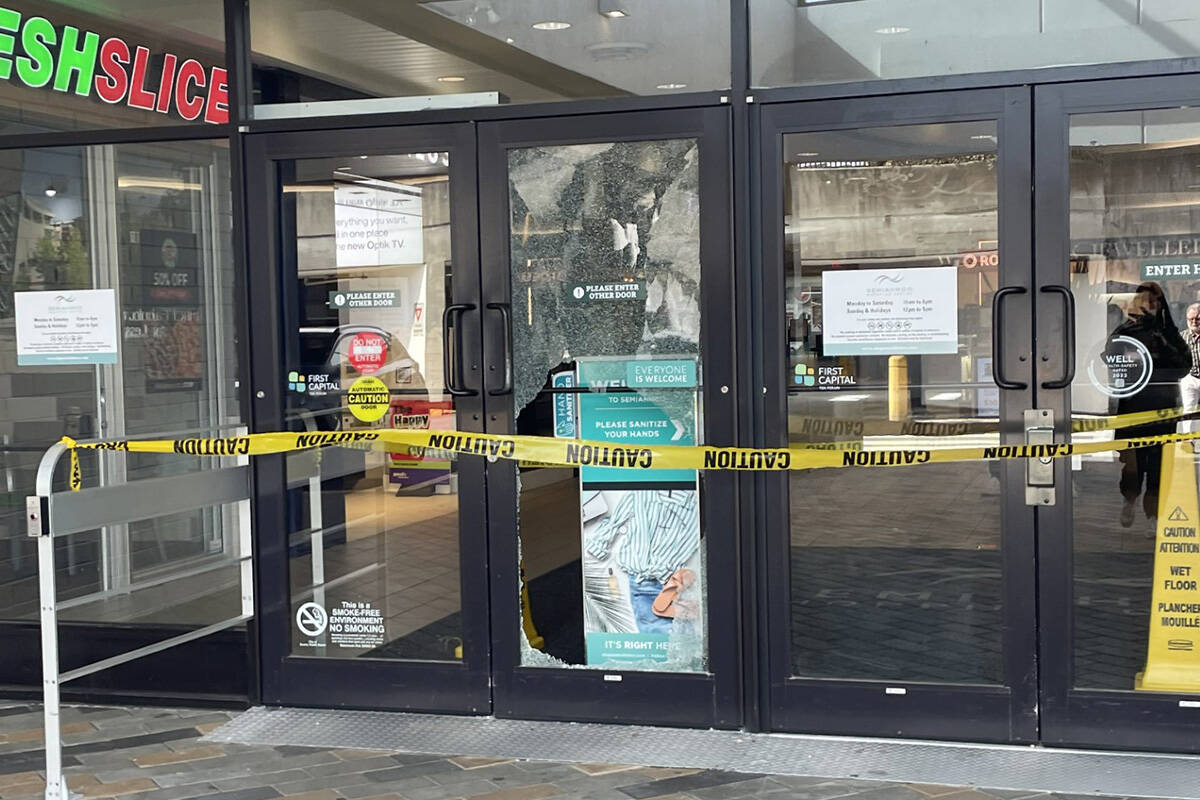 The door to Semiahmoo Shopping Centre is seen smashed and taped off after a break-and-enter in the early hours of Monday, March 25. (Contributed photo)