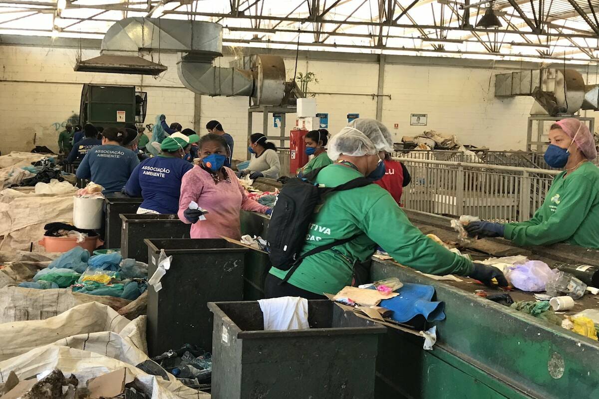 Recycling sorters pick through waste at a Brazil cooperative. (Courtesy of Jutta Gutberlet)