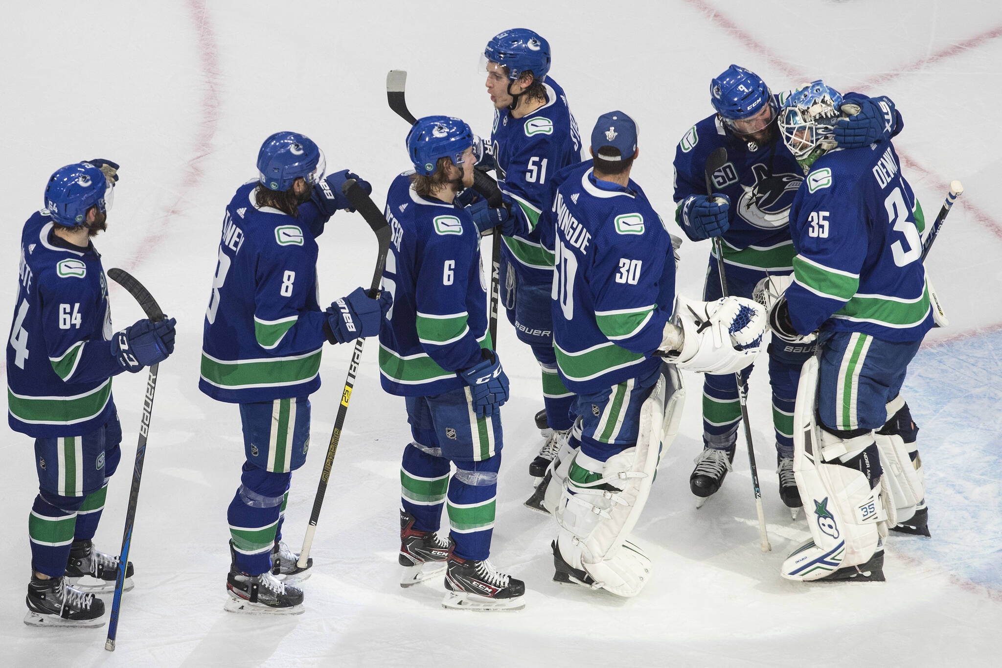 Vancouver Canucks goalie Thatcher Demko (35) and teammates celebrate the win over the Vegas Golden Knights during third period NHL Western Conference Stanley Cup playoff action in Edmonton on Thursday, Sept. 3, 2020 — the team’s most recent playoff victory. THE CANADIAN PRESS/Jason Franson