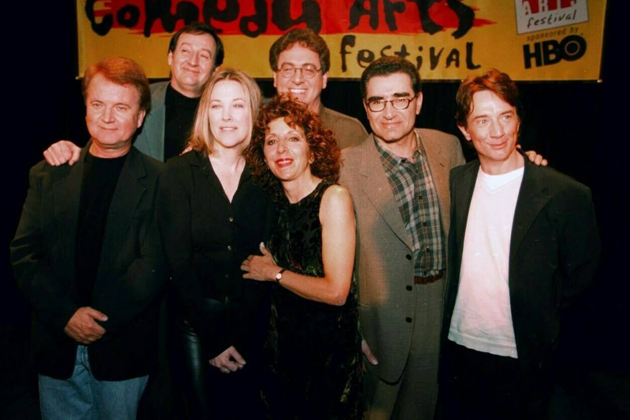 Former cast members of SCTV are reunited at the U.S. Comedy Arts Festival on Saturday, March 6, 1999 in Aspen, Colo. From left front row are: Dave Thomas; Catherine O’Hara; Andrea Martin; Eugene Levy; and Martin Short. In the back row are Joe Flaherty, left, and Harold Ramis. THE CANADIAN PRESS/AP/E Pablo Kosmicki