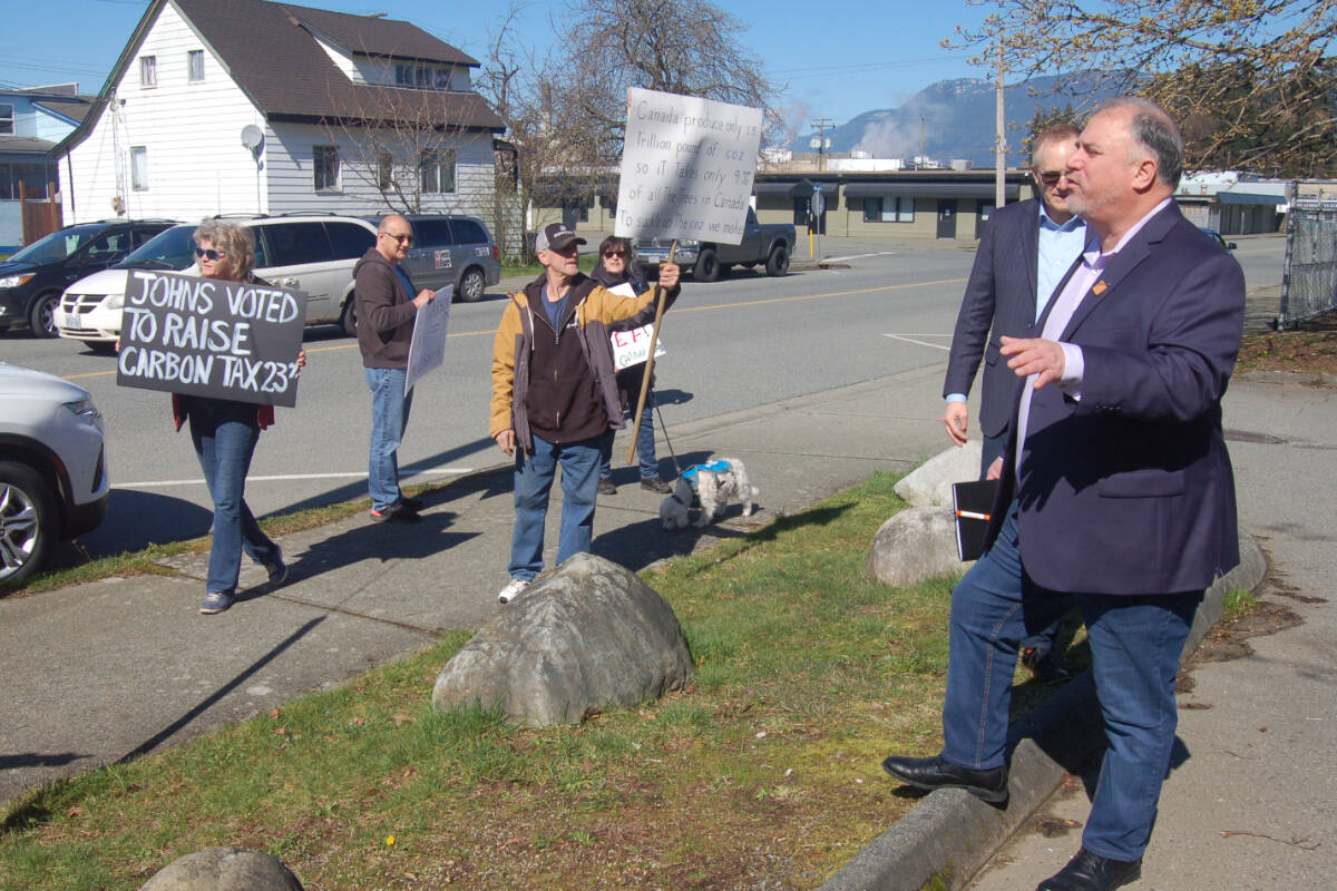 Courtenay-Alberni MP Gord Johns, right, talks to protesters in front of the Port Alberni Friendship Center on Sunday, March 24, 2024. (PHOTO COURTESY CHARLAINE LACROIX)