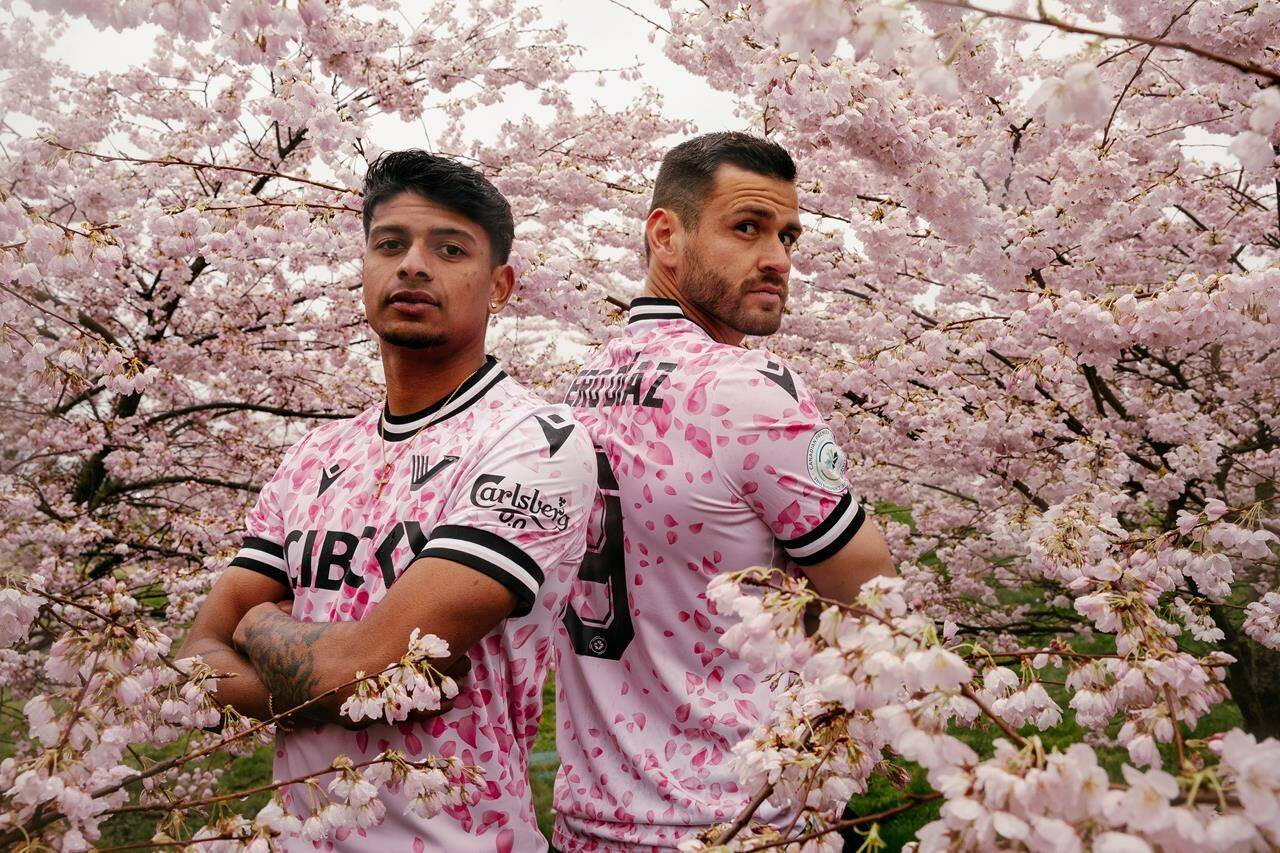 Vancouver FC players Zach Verhoven (left) and Wero Díaz model the Canadian Premier League team’s new alternate kit dubbed the Cherry Blossom Kit in an undated handout photo. A portion of the proceeds from each jersey will be donated to the Pink Shirt Day campaign which raises awareness about bullying.THE CANADIAN PRESS/HO-Beau Chevalier/Vancouver FC