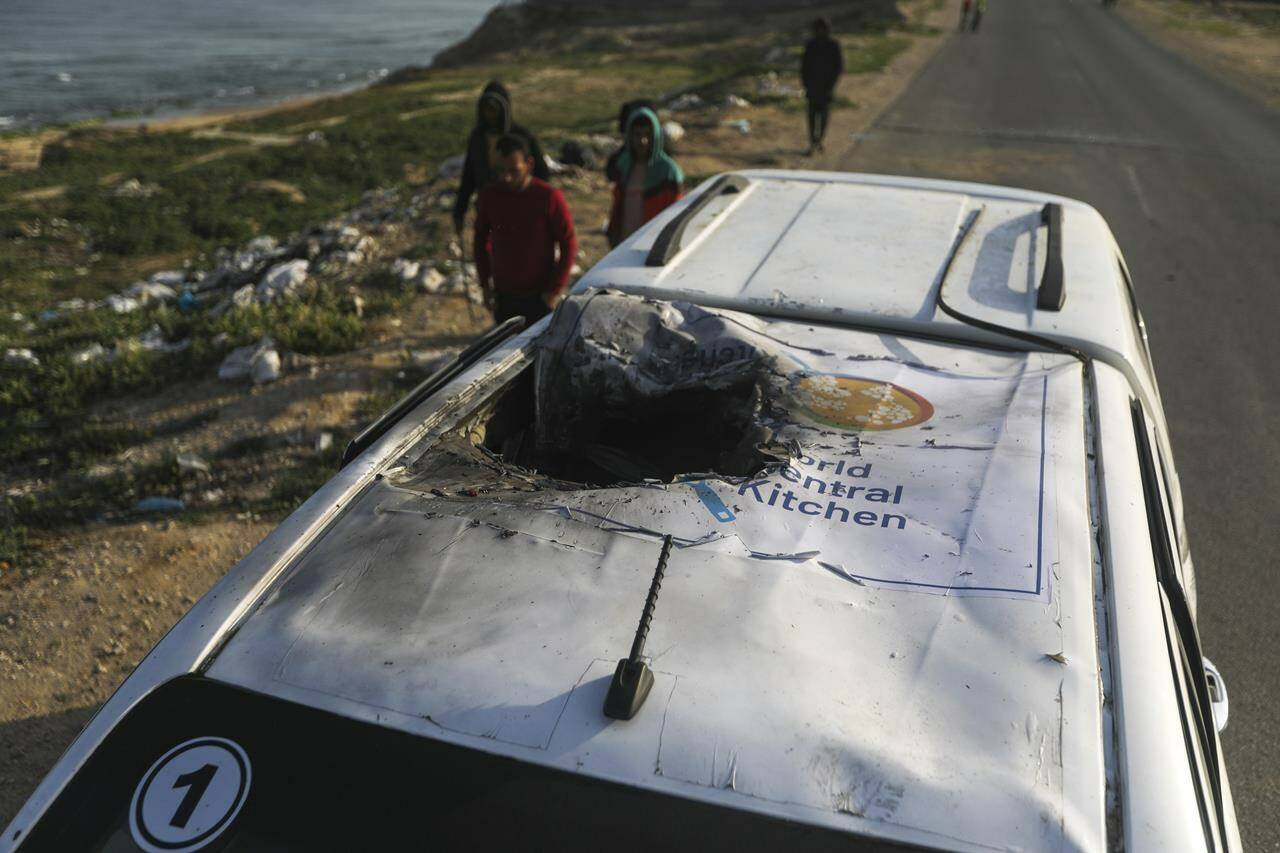 The founder of the global relief charity whose workers were killed by Israeli air strikes in the Gaza Strip on Monday is pleading with Israel to start the “long journey to peace.”Palestinians inspect a vehicle with the logo of the World Central Kitchen wrecked by an Israeli airstrike in Deir al Balah, Gaza Strip, Tuesday, April 2, 2024. THE CANADIAN PRESS/AP/Ismael Abu Dayyah