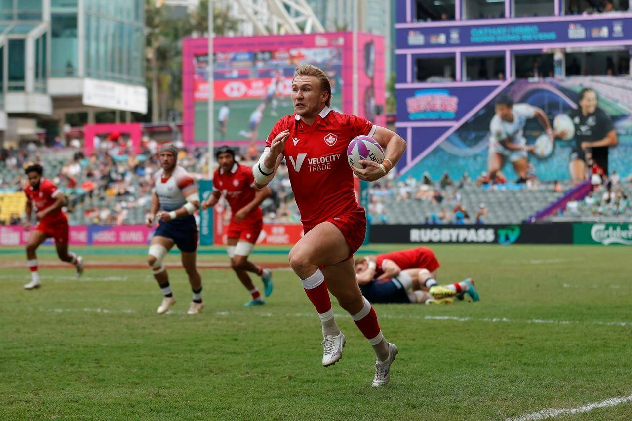 Canada’s Ethan Hager races away from the Britain defence at the Cathay/HSBC Hong Kong Sevens in Hong Kong in a Sunday, April 7, 2024, handout photo. THE CANADIAN PRESS/HO-World Rugby, KLC fotos, Mike Lee