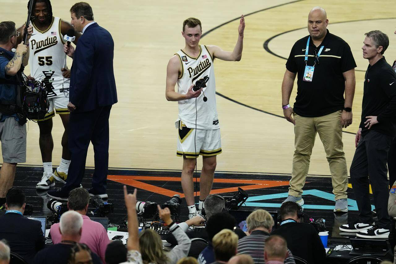 Purdue guard Fletcher Loyer waves to fans after the NCAA college basketball game against NC State at the Final Four, Saturday, April 6, 2024, in Glendale, Ariz. (AP Photo/Ross D. Franklin)